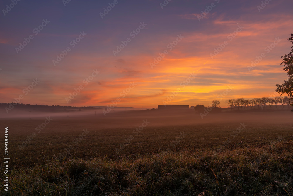 Orange sunrise in Vrsovka village in autumn nice morning