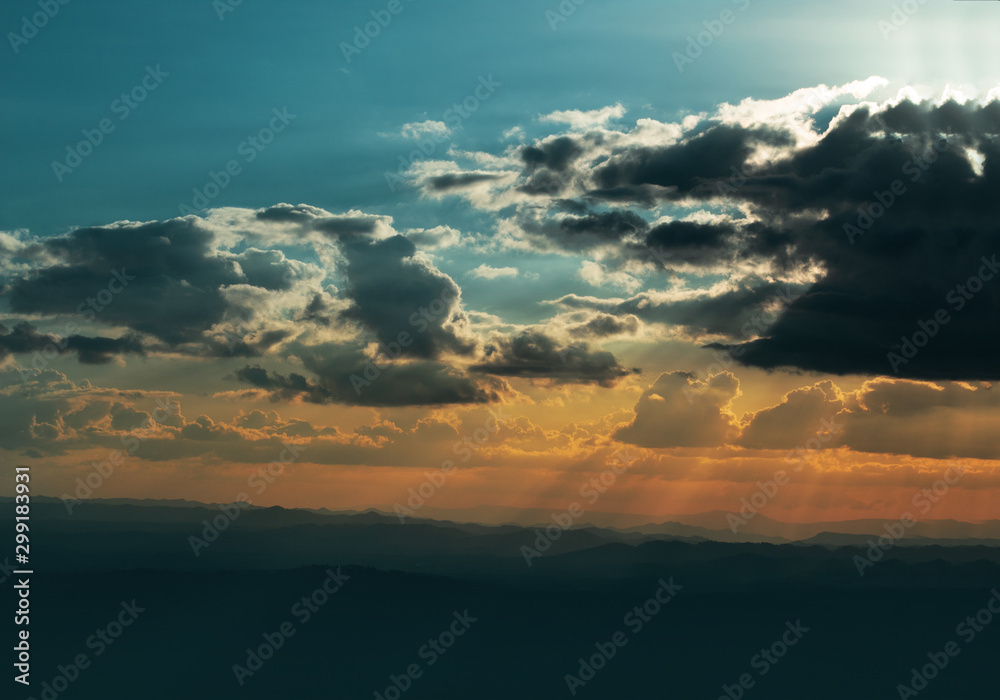 summer evening of weather climate nature sky cloudscape with sunset light and moutain forest background