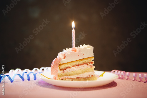 Happy birthday cake with burning candle, anniversary celebration card