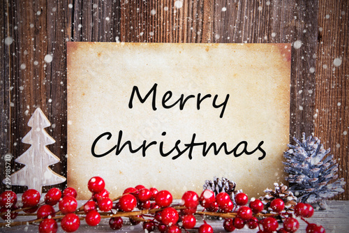 Paper With English Text Merry Christmas. Christmas Decoration And Wooden Background With Snow