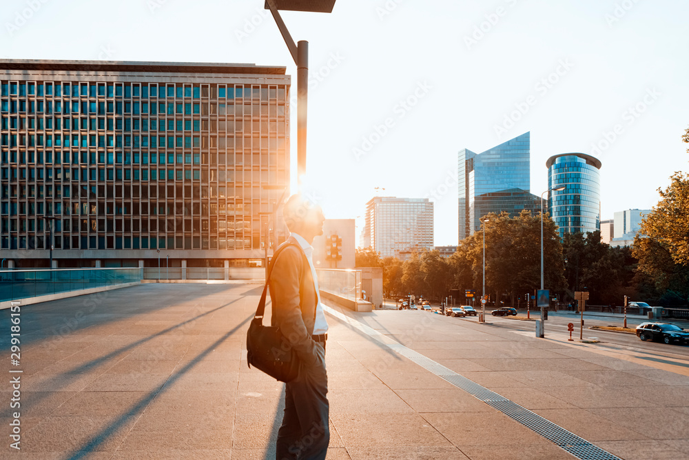 © Carlo - businessman looking away in a city landscape on sunset - business, job, career, success, confident, management, employee, glory, concept © Carlo - businessman looking away in a city landscape on sunset - business, job, career, success, confident, management, employee, glory, concept
