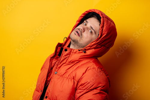 Style man in 90s jacket on yellow background © Simonforstock