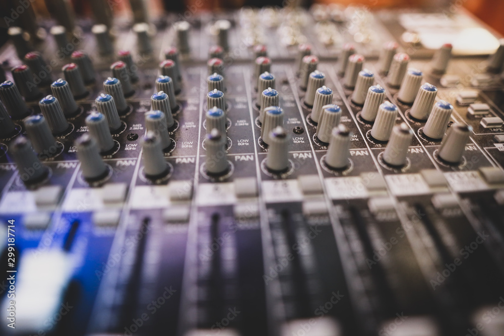 Shallow depth of field (selective focus) image with the controls on an audio mixer Shallow depth of field (selective focus) image with the controls on an audio mixer