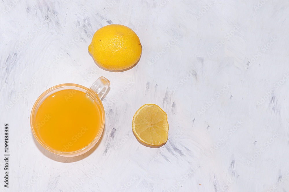 Lemon juice, homemade energy anti-inflammatory drink and ingredients, top view, copy space. It has anti-inflammatory and antioxidant properties, is used to treat and preserve the body's youth, Lemon juice, homemade energy anti-inflammatory drink and ingredients, top view, copy space. It has anti-inflammatory and antioxidant properties, is used to treat and preserve the body's youth,