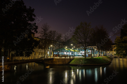 Small island zone of fish market in city center at night Treviso Italy