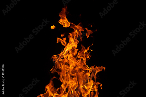 hot orange fire on black background © Sandu