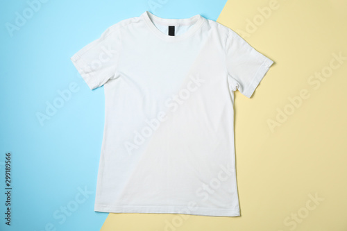Blank white t-shirt on two tone background, space for text