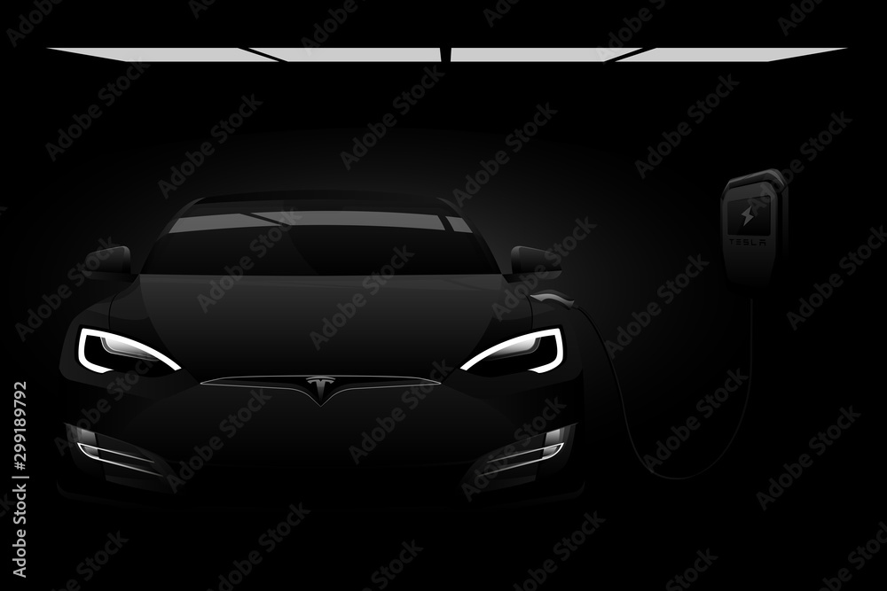 Black electric car Tesla Model S with a charging station in the