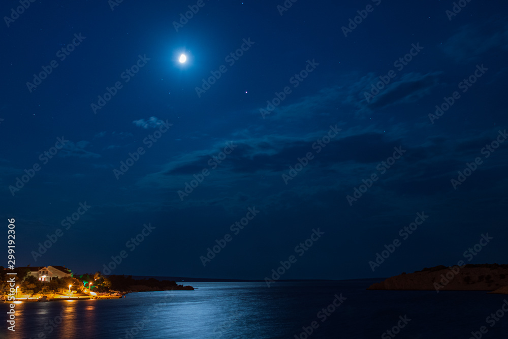 Fototapeta premium Deep blue moonlight ocean at night with calm waves in Croatia
