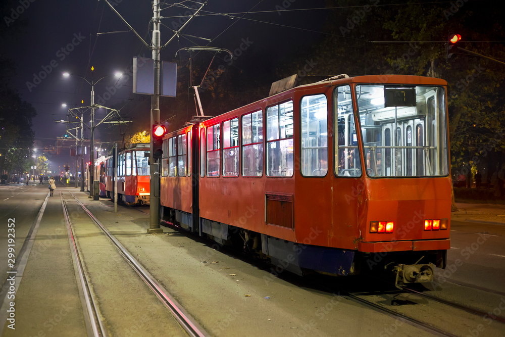 Red trams in the night
