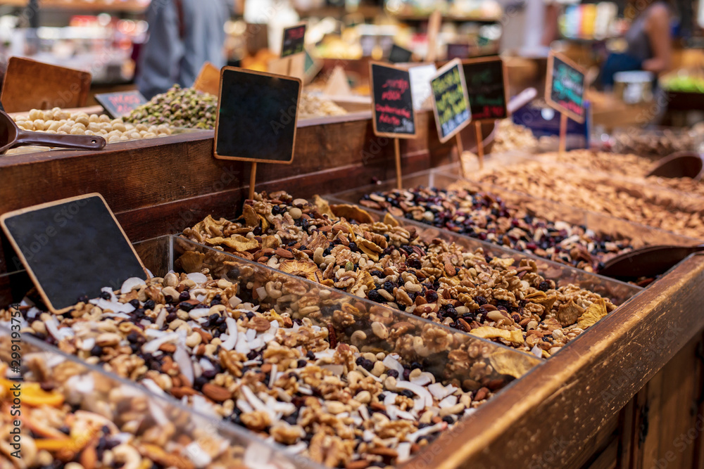 Mix of dried fruits, nuts and berries in drawers with plates Mix of dried fruits, nuts and berries in drawers with plates
