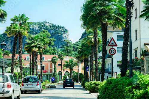 Photography Landscape with cars on road at Arco palm trees