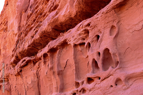 A reddish sandstone wall that appears to be melting