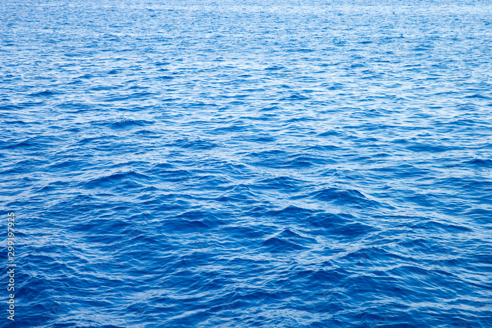 Fototapeta premium Sea background . Blue water with sun reflections