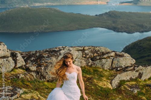 Bride in wedding dress in mountains