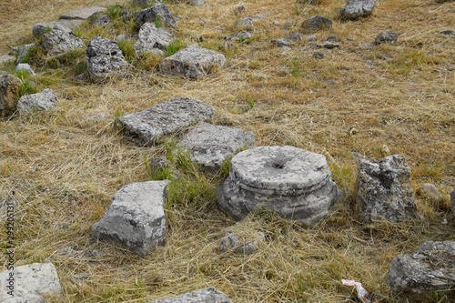 Fragments of ancient buildings, ruins of the ancient city of Hierapolis. Stone blocks with traces of stone machining.