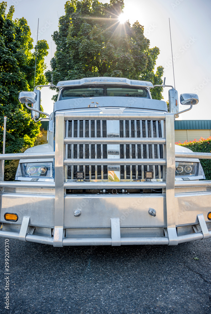 Front of big rig semi truck tractor with powerful grille bumper guard ...