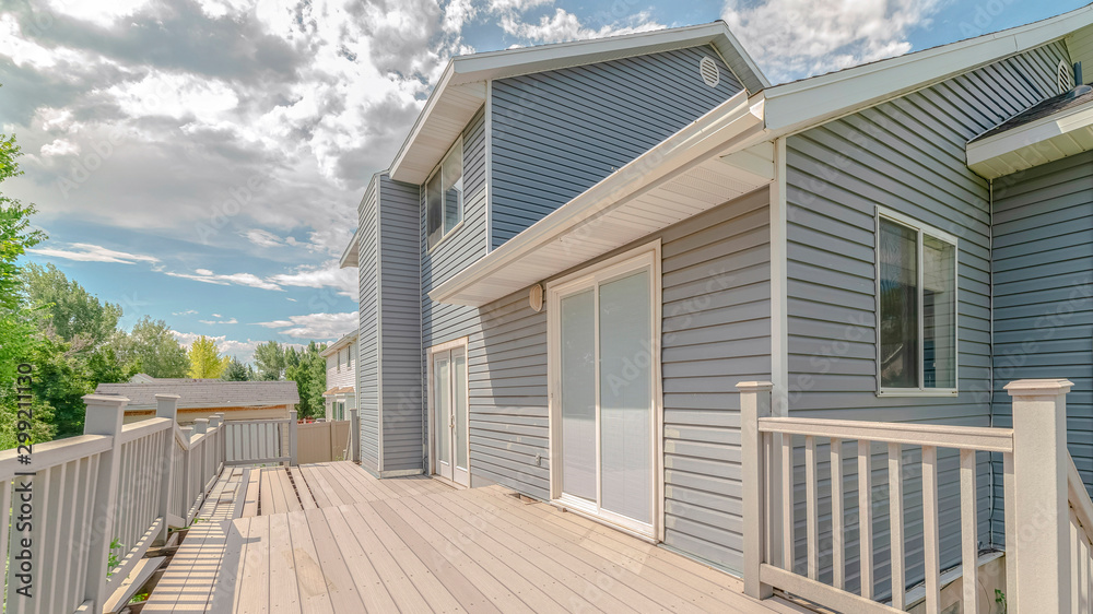 Fototapeta premium Panorama Modern two storey home with unfinished deck area