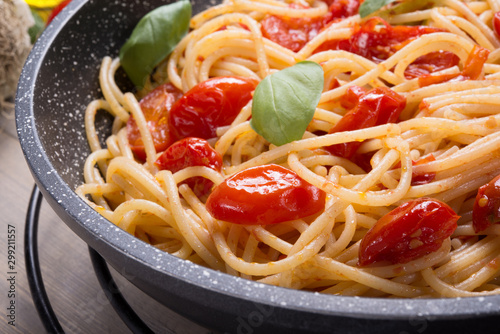 Spaghetti with cherry tomatoes, and basil