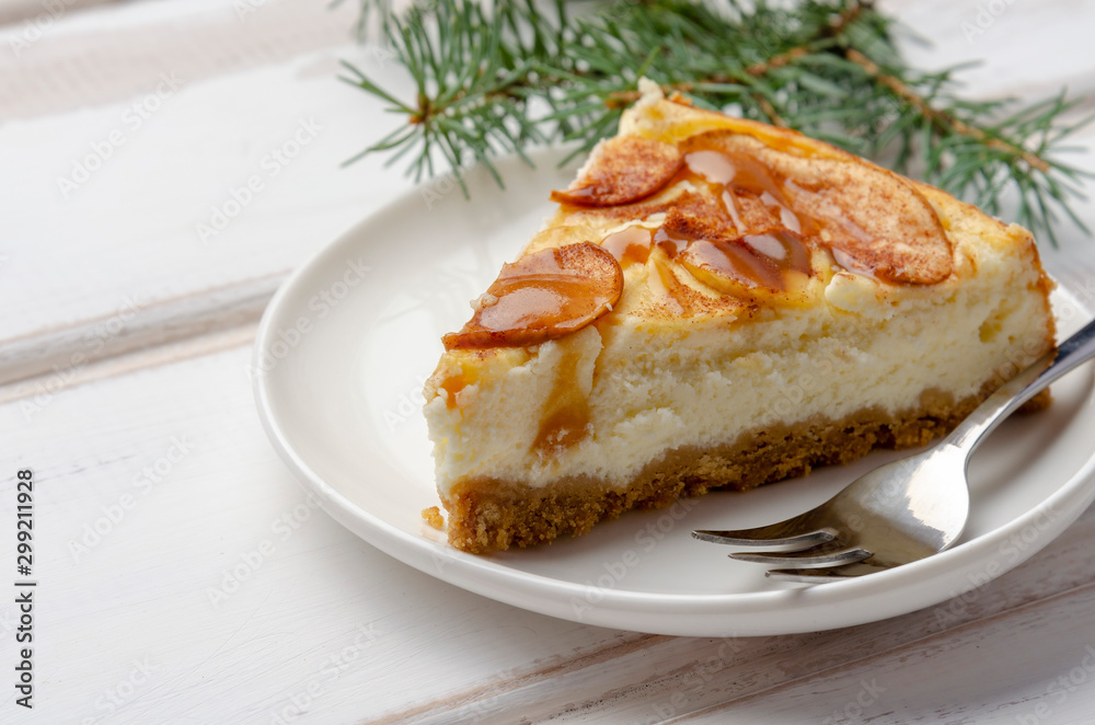Christmas holiday cheesecake with apples. On wooden table with copy space Christmas holiday cheesecake with apples. On wooden table with copy space