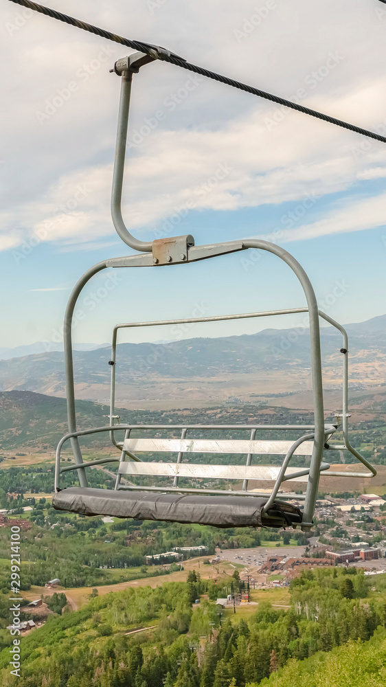 Vertical Chairlift and aerial view of a ski resort in Park City during off season months Vertical Chairlift and aerial view of a ski resort in Park City during off season months