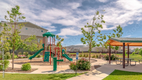 Panorama Park at a sunny neighborhood with childrens playground and pavilion eating area photo