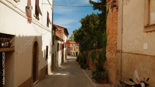 Walking along picturesque houses in the medieval town Lajatico, Tuscany, Italy, the home town of tenor Andrea Bocelli photo