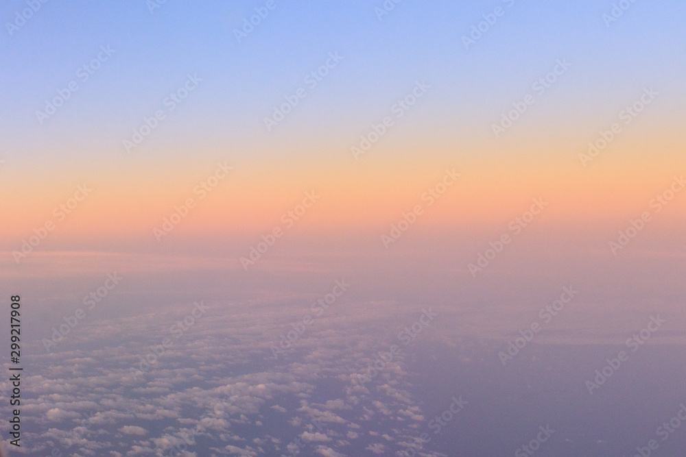 Sky - OCTOBER 16, 2019:  Landscape sunrise view with clouds from airplane window seat