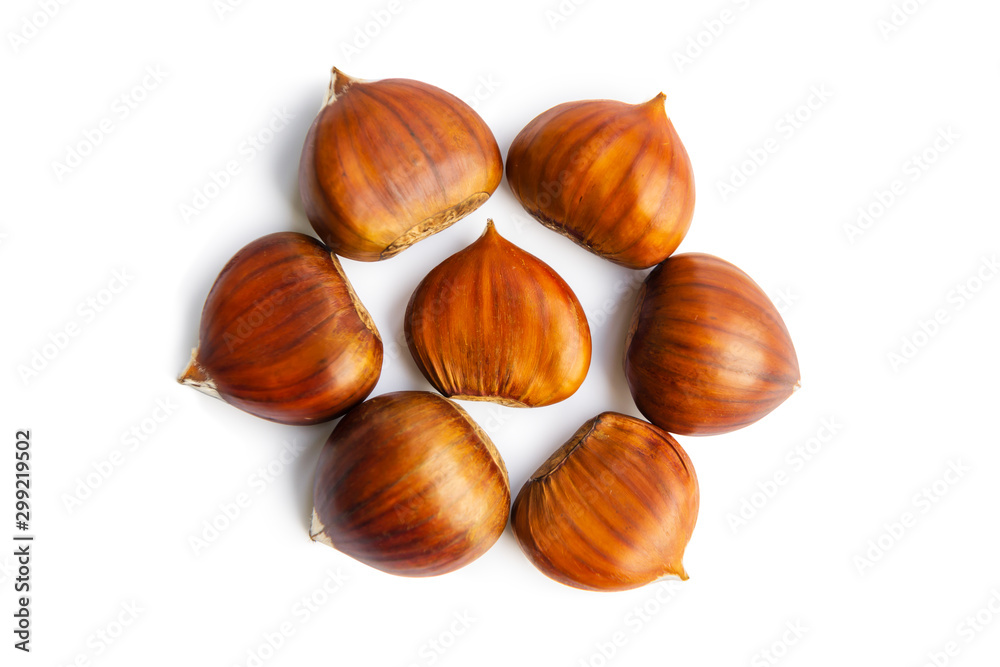 The group of sweet chestnuts isolated on a white background The group of sweet chestnuts isolated on a white background