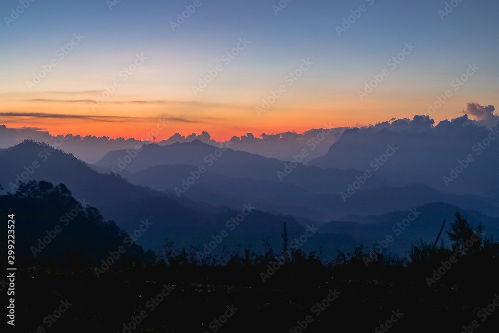 Sunset or sunrise mountain peaks colorful sky