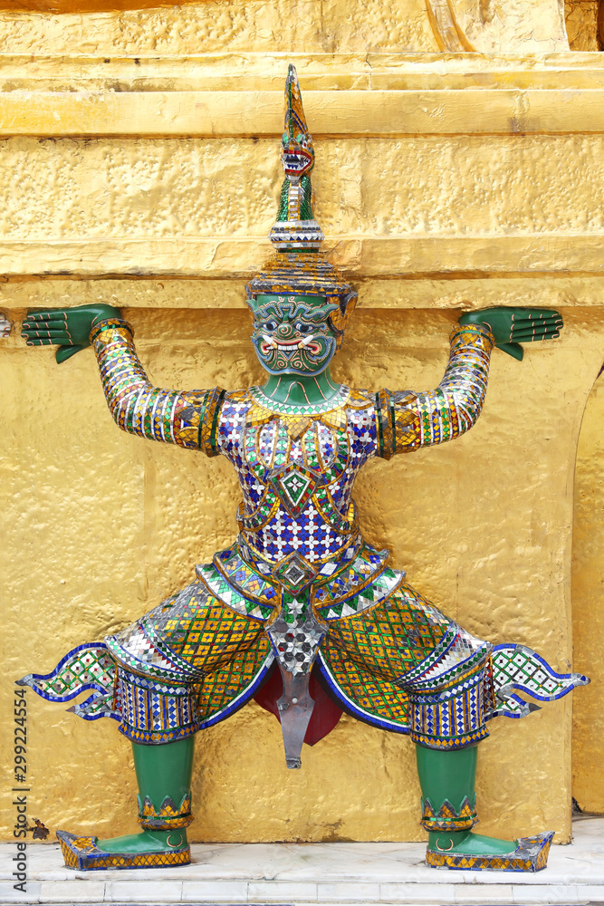 sculpture of demon which support golden chedi