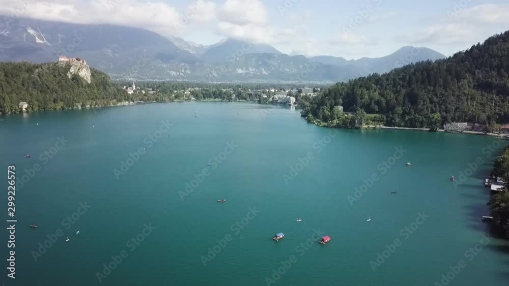 Drone flying over turquoise lake Drone flying over turquoise lake