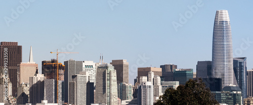 Urban skyline in downtown San Francisco on a sunny day, with clear blue sky
