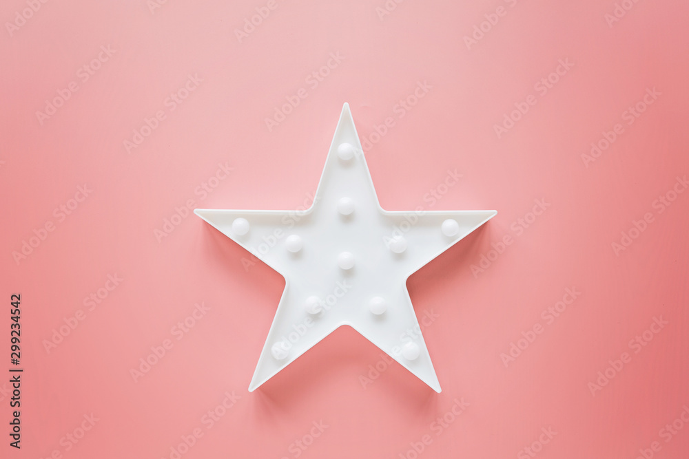 Star shaped white LED lights lamp single frame. Creative conceptual top view flat lay composition with copy space on pink background in minimal style. Overhead, template, mockup Star shaped white LED lights lamp single frame. Creative conceptual top view flat lay composition with copy space on pink background in minimal style. Overhead, template, mockup