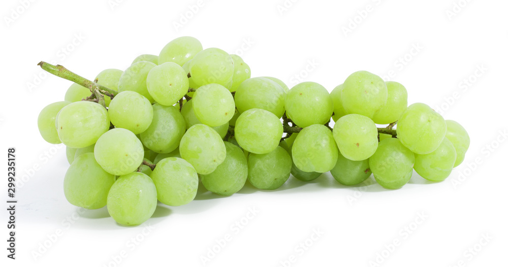 Green grapes lying horizontally on white background