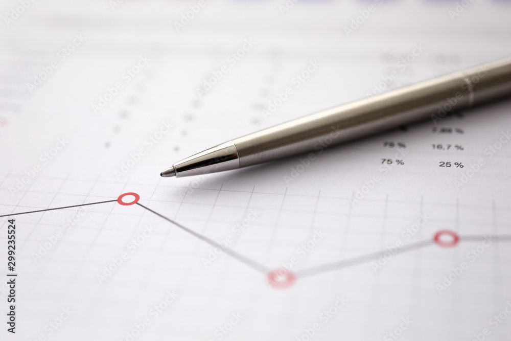 Business background chart with silver pen lie Business background chart with silver pen lie
