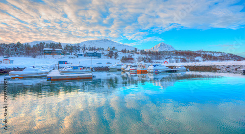 Beautiful landscape cracking ice, frozen norwegian sea coast at sunrise - Tromso, Norway