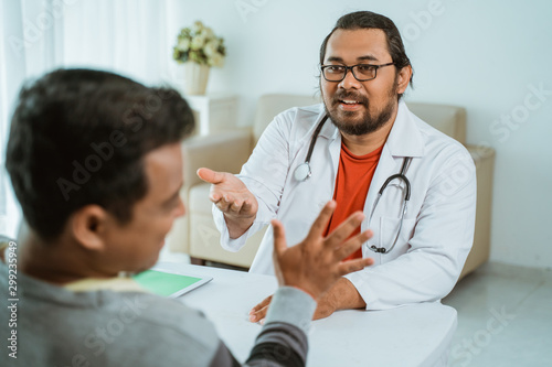 gesture of doctor asking for his payment to patient in clinic