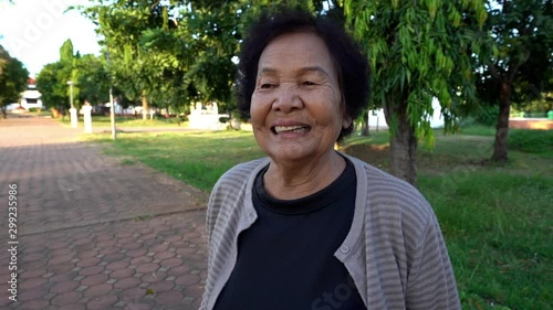 slow-motion of senior woman laughing photo