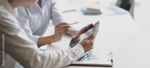 Cropped shot of two professional business partner discussing their project together
