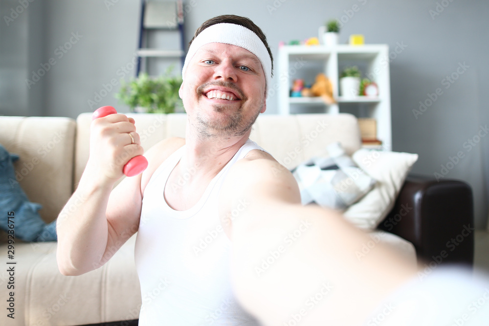 Cheerful Sportsman Doing Exercise with Dumbbell Cheerful Sportsman Doing Exercise with Dumbbell