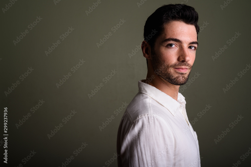 Obraz premium Portrait of young handsome businessman with stubble beard