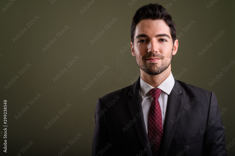 Face of young handsome businessman in suit looking at camera Face of young handsome businessman in suit looking at camera