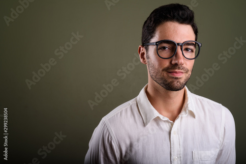 Portrait of young handsome businessman wearing eyeglasses © Ranta Images