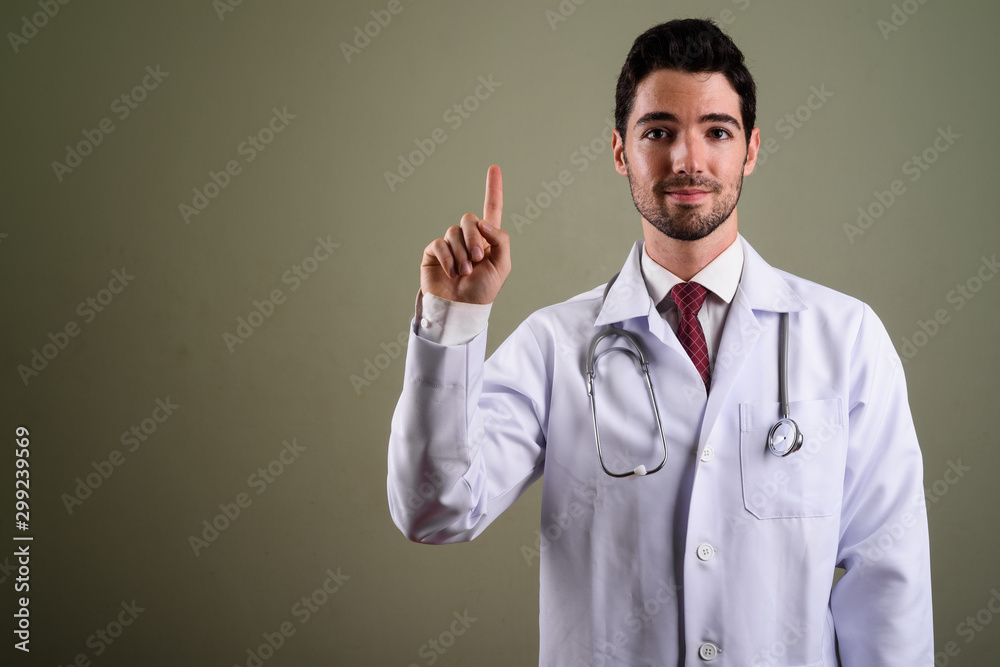 Portrait of young handsome man doctor with stubble beard Portrait of young handsome man doctor with stubble beard