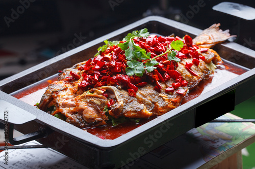 A plate of grilled fish, sichuan cuisine