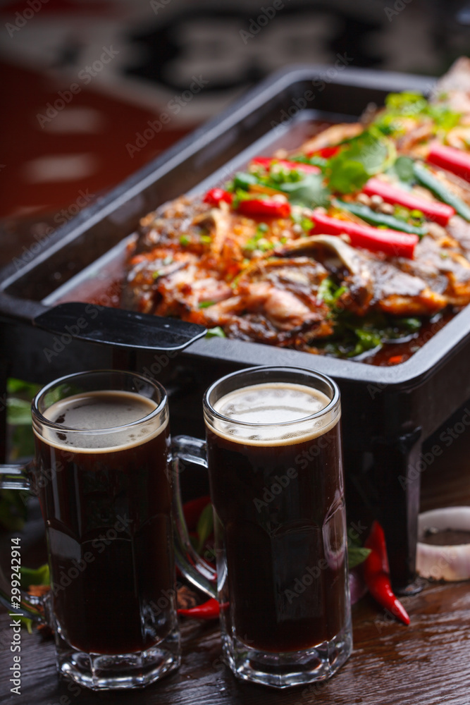 A plate of grilled fish, sichuan cuisine A plate of grilled fish, sichuan cuisine