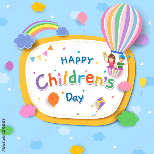 Children's Day with boy and girl on balloon and rainbow on blue sky 