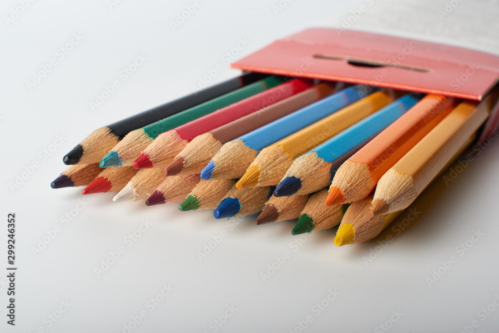 Obraz premium Color pencils on white background, copy space