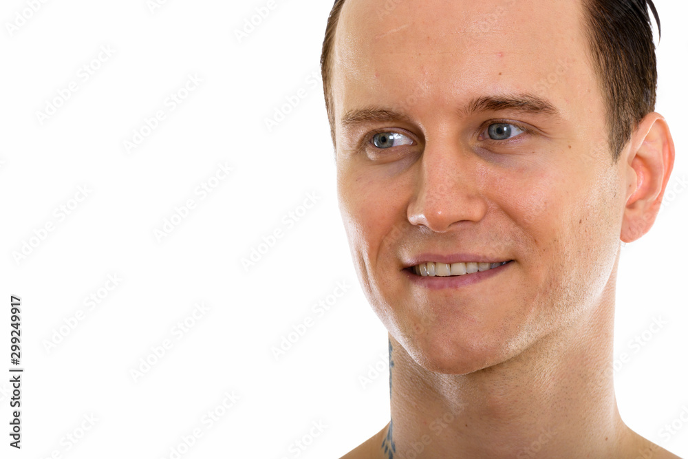 Studio shot of face of young handsome man shirtless